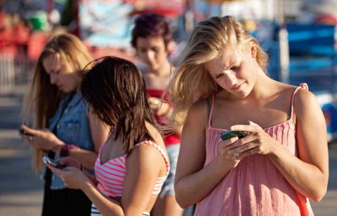 google images

Shown here is the common sight of teenagers addicted to their phones, probably checking Snapchat.