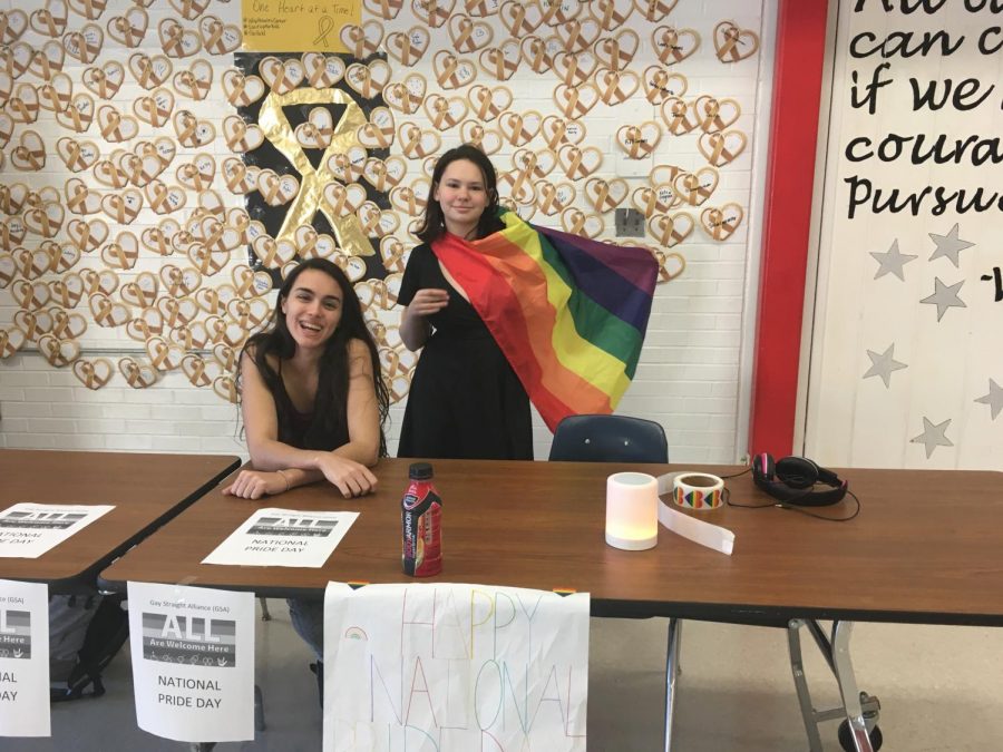 The GSA celebrates National Pride Day by giving students rainbow stickers. 